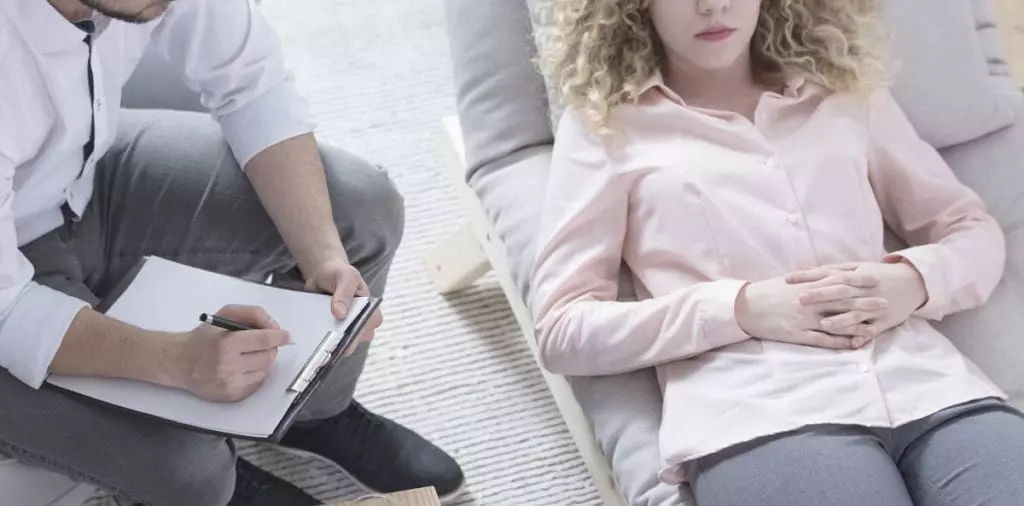 A young woman seeking support for PTSD