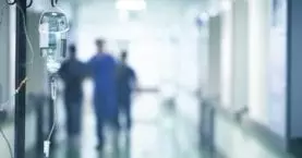 Medical professionals walking down a hallway at FHE Health's treatment center