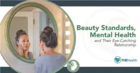 Picture of a woman looking in the mirror while struggling with unrealistic beauty standards
