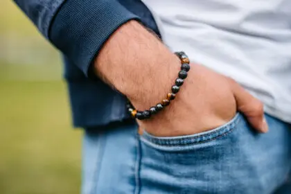 Close-up of a young man's worry bracelet.