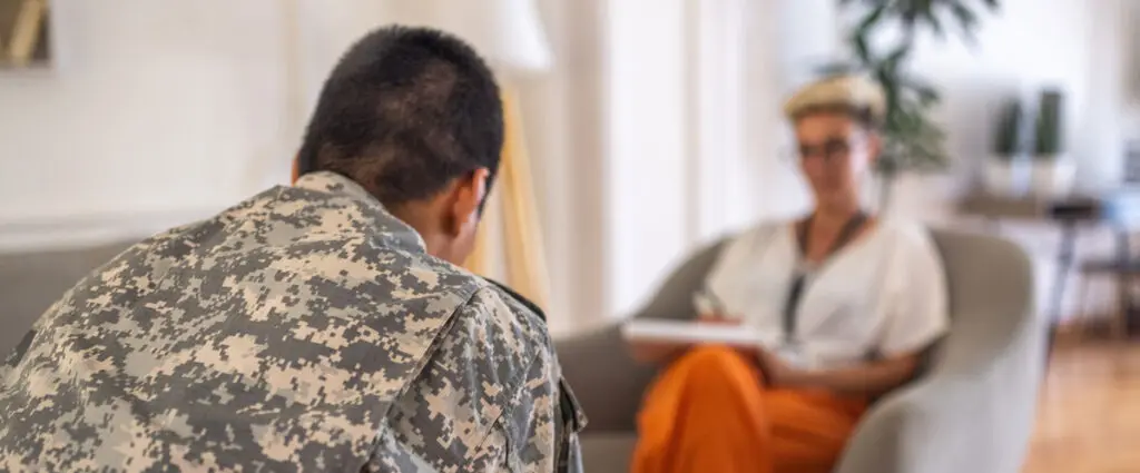 Veteran talking with a counselor at FHE Health